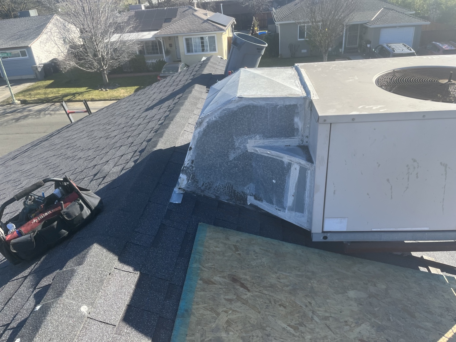 Sheet metal ductwork connecting a rooftop heating and cooling unit